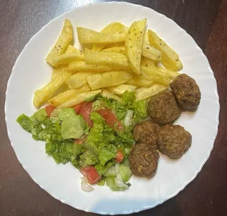 Authentic Albanian Qofte meatballs served with homemade fries and garden salad